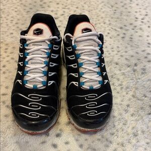 Nike Air Max Plus 'Black Aquamarine' sneakers with a turf orange sole.